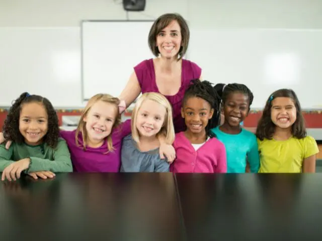 teacher and students smiling