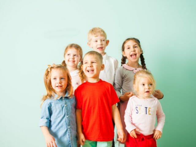 young kids singing in class